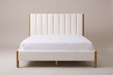 Ofena white boucle channel bed with a white mattress and pillows (not included), front view, Queen shown
