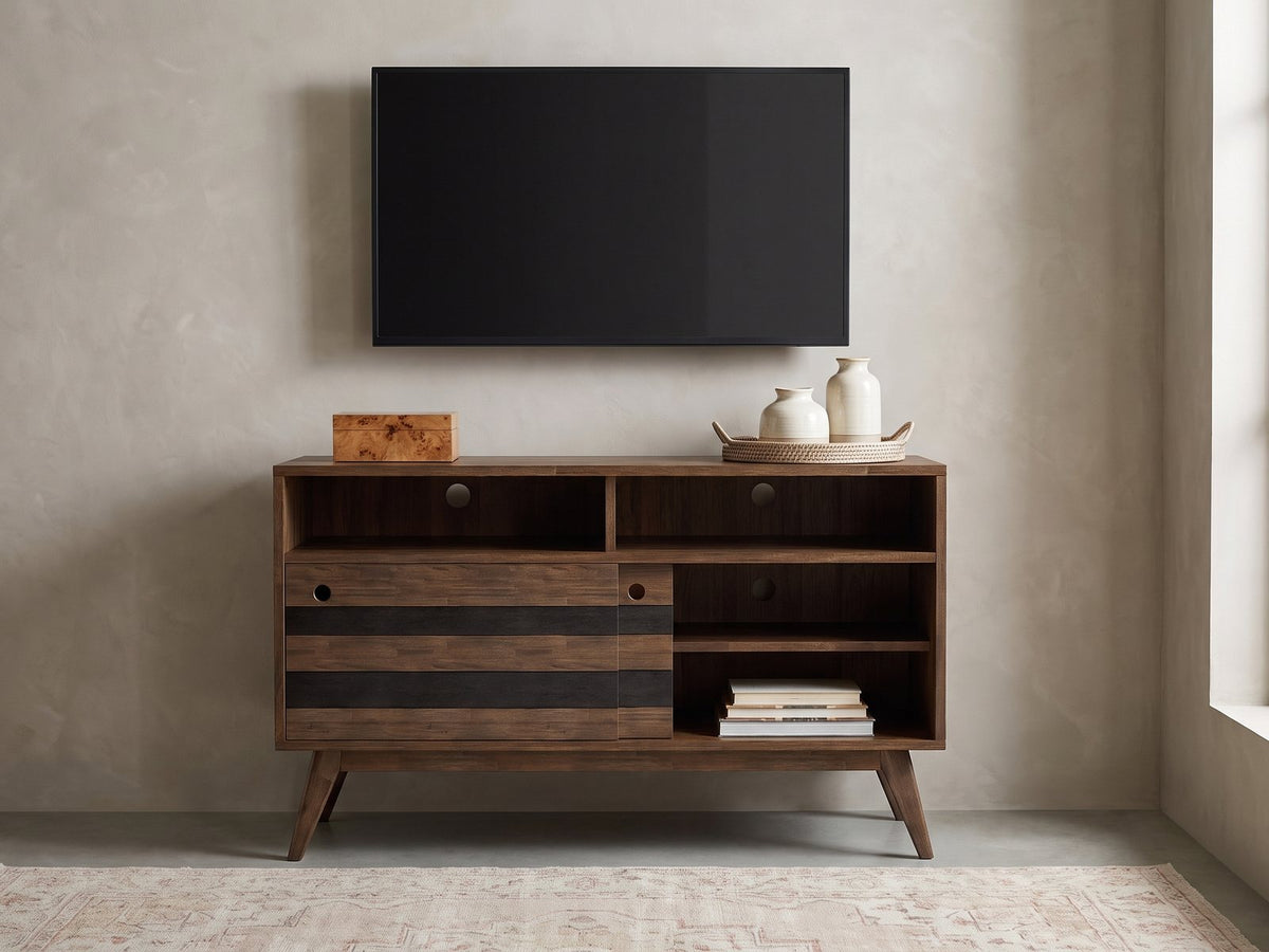 Offida Two-Tone Acacia Media Console styled with a box, a tray of vases and books under a wall-mounted screen