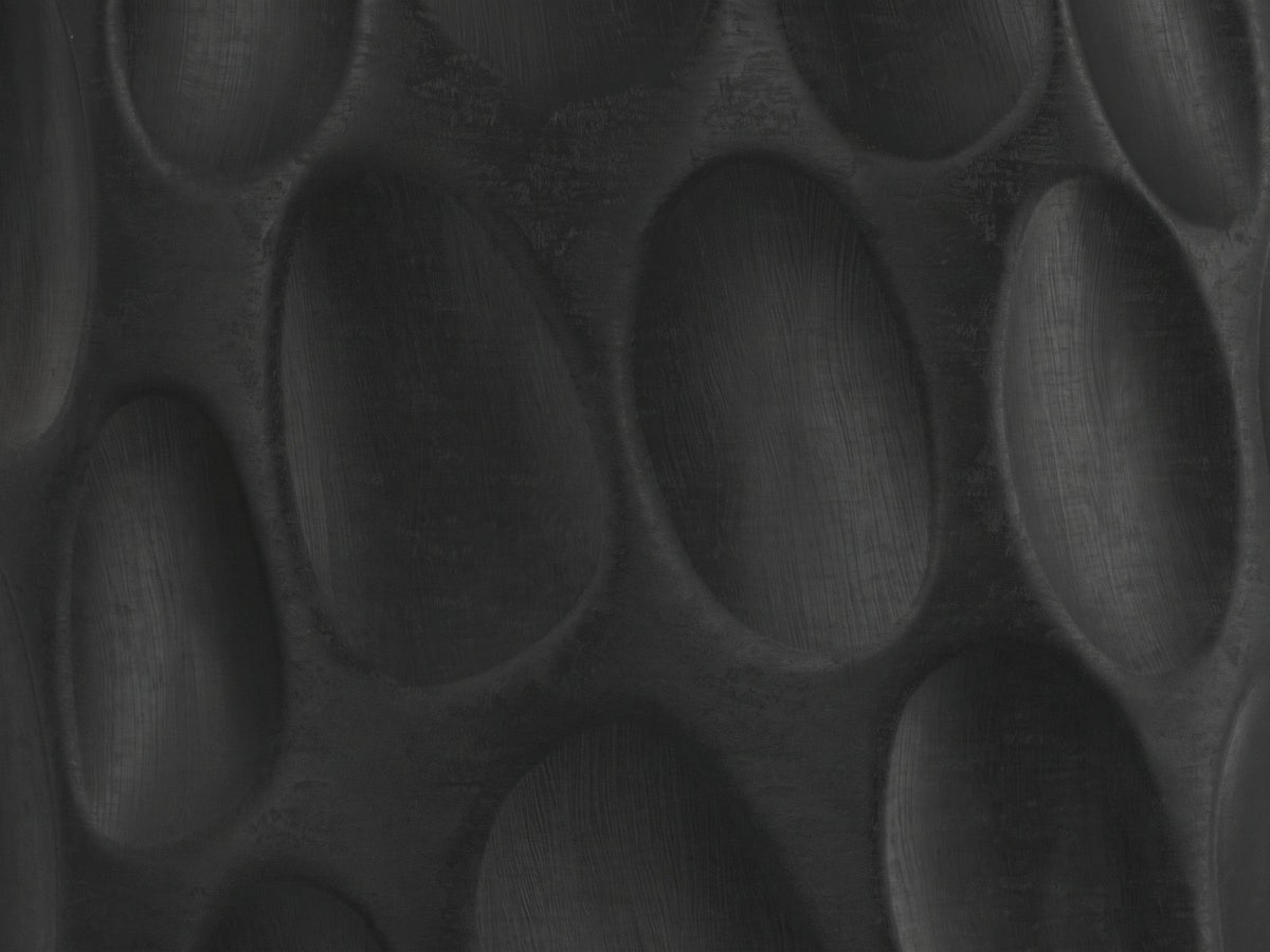 Close-up of the Olevano Carved Black Mango Pedestal Side Table: the hand-carved oval scoops of the base