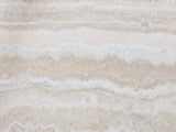 Close-up of the Orbetello Faux Travertine Oval Arch Coffee Table: the honed travertine-look veining of the oval top