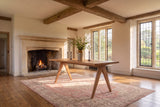 Oriolo 63-Inch Rectangular Solid Wood Dining Table in an English country dining room