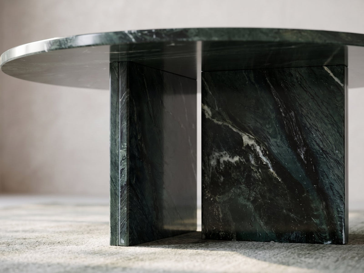 Close-up of the Orosei Verde Marble Coffee Table: the two green marble slabs of the base meeting under the top