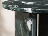 Close-up of the Orosei Verde Marble Round Side Table: the polished edge of the green marble top over a base slab
