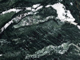 Close-up of the Orosei Verde Marble Round Side Table: the veining of the polished green marble top