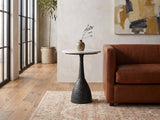 Orsara White Marble Pedestal Side Table beside a leather sofa in an industrial loft