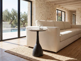 Orsara White Marble Pedestal Side Table beside a linen sofa in a poolside villa