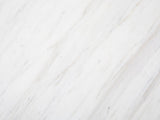 Close-up of the Orsara White Marble Pedestal Side Table: the genuine white marble of the top