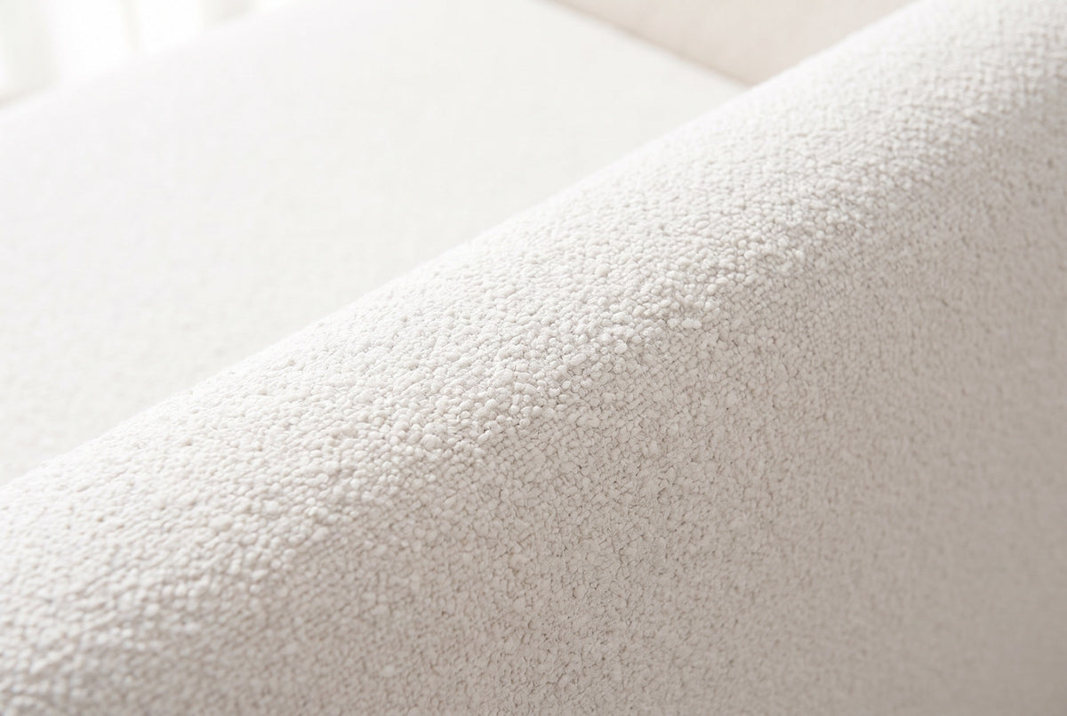 Close-up of the white boucle on the smooth rounded top edge of a Pacentro bed rail