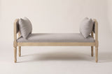 The Paciano bench in pale washed wood and greige fabric, straight front view on a light studio backdrop