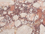 Close-up of the Paestum Rosa Marble Coffee Table: the veining of the polished rosa marble top