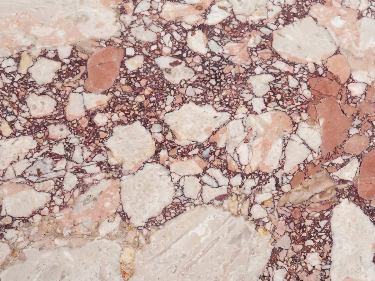 Close-up of the Paestum Rosa Marble Coffee Table: the veining of the polished rosa marble top