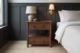 Palau solid neem nightstand against charcoal board-and-batten panelling in a Seattle bedroom with a brass wall light