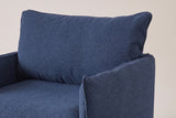 The Palazzolo chair up close: the big loose back pillow with its flange edge and the slim arm with its top seam