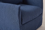 Close-up of the navy outdoor fabric on the Palazzolo chair: the arm seam and the front of the seat cushion