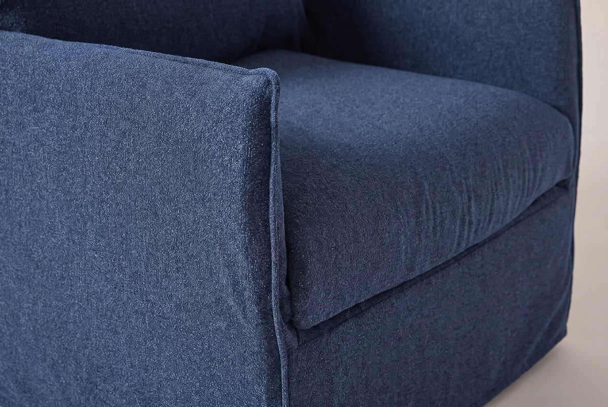 Close-up of the navy outdoor fabric on the Palazzolo chair: the arm seam and the front of the seat cushion