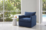 Palazzolo navy club chair in a mid-century Sarasota lanai with a white block wall, a terrazzo floor and a pool beyond the screen (side table not included)