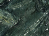 Close-up of the Panarea Verde Marble Nesting Coffee Tables, Set of 2: the veining of the polished verde marble