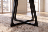 Close-up of the Paola 47.5-Inch Round Black Ash Dining Table: base