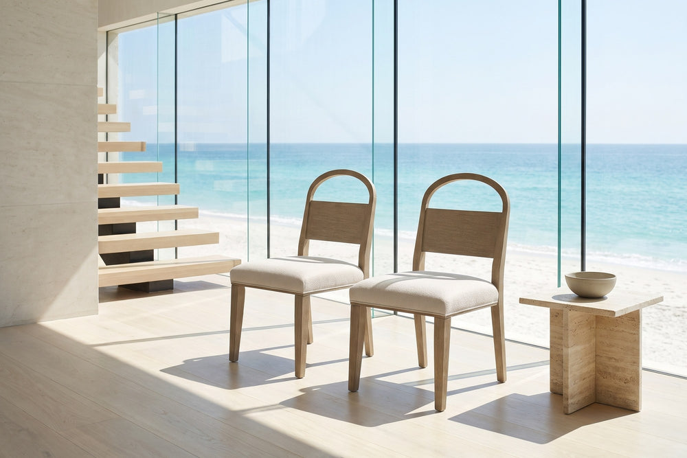 Parghelia Arch-Back Upholstered Wood Dining Chair (Set of 2) in an oceanfront glass house