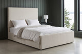 Penne ivory canvas bed against charcoal-green vertical panelling in a Seattle waterfront bedroom, a tall window onto grey water and evergreens at the right