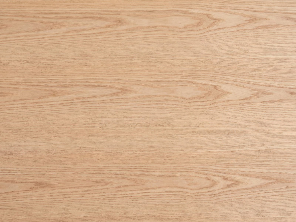 Close-up of the Pesaro Ash Veneer Fluted Pedestal Coffee Table: the natural ash veneer grain of the top