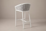 A Petralia stool from behind: the grey rope barrel back, the white top band, the slim round legs and the rails between them