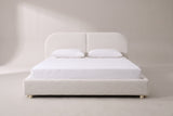 Pietrabbondante bed in ivory boucle with a white mattress and pillows (not included), front view