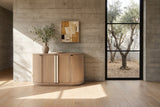 Pietrafitta 54-Inch 4-Door Rounded Oak Veneer Server with Stone Pulls in a sunlit villa dining room