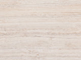Close-up of the Piombino Faux Travertine Fiberglass Drum Coffee Table: the vein-cut travertine look of the top