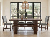 Pizzo 76-Inch Walnut Veneer Extending Trestle Dining Set with Bench and 4 Chairs in a sunlit villa dining area with olive trees outside