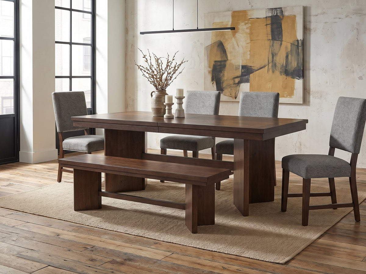 Pizzo 76-Inch Walnut Veneer Extending Trestle Dining Set with Bench and 4 Chairs in an industrial loft dining area