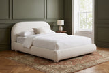 Pollutri bed in a Brooklyn brownstone bedroom with olive green walls, white mouldings and a herringbone oak floor