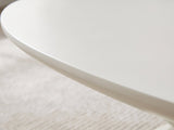 Close-up of the Ponza Milk White Fiberglass Pebble Coffee Table: the softly rounded satin edge of the milk white top