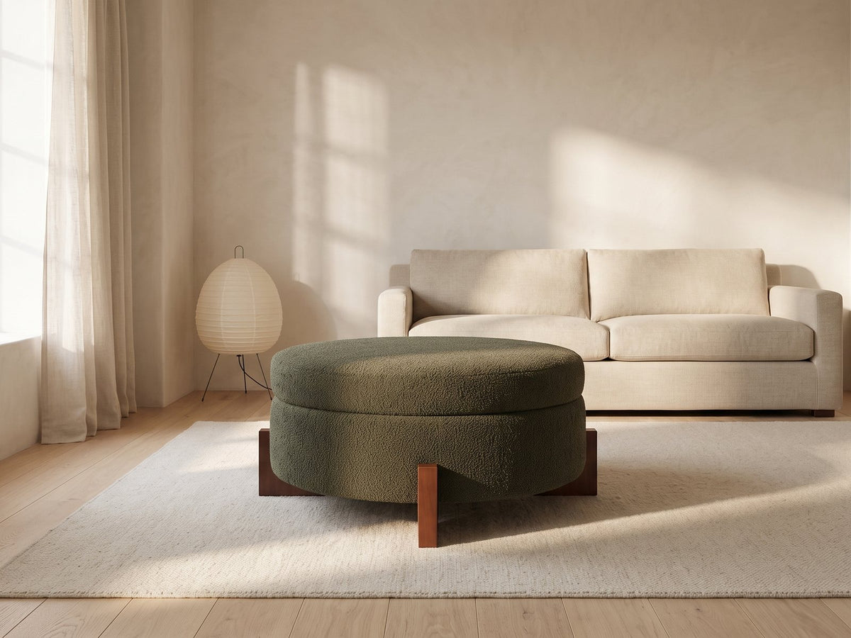 Portofino Round Storage Ottoman in a furnished room
