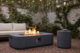 Portopalo fire pit lit in a walled Savannah courtyard with a whitewashed brick wall, fig ivy, Spanish moss and a herringbone brick floor (sofa not included)