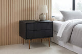 Posada black oak nightstand against pale white oak wall slats in a Seattle bedroom with a wool carpet