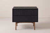 The Posada nightstand in black wire-brushed oak, front view on a light studio backdrop