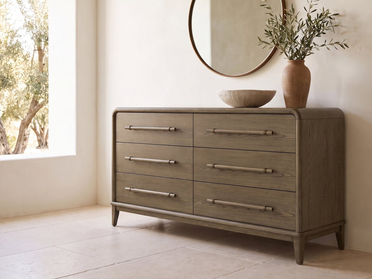 Possagno 54-Inch Latte Elm 6-Drawer Dresser under a round bronze mirror in a villa bedroom