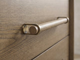 Close-up of the Possagno 54-Inch Latte Elm 6-Drawer Dresser: the wooden dowel pull held in antique-brass loops on the latte elm drawer front