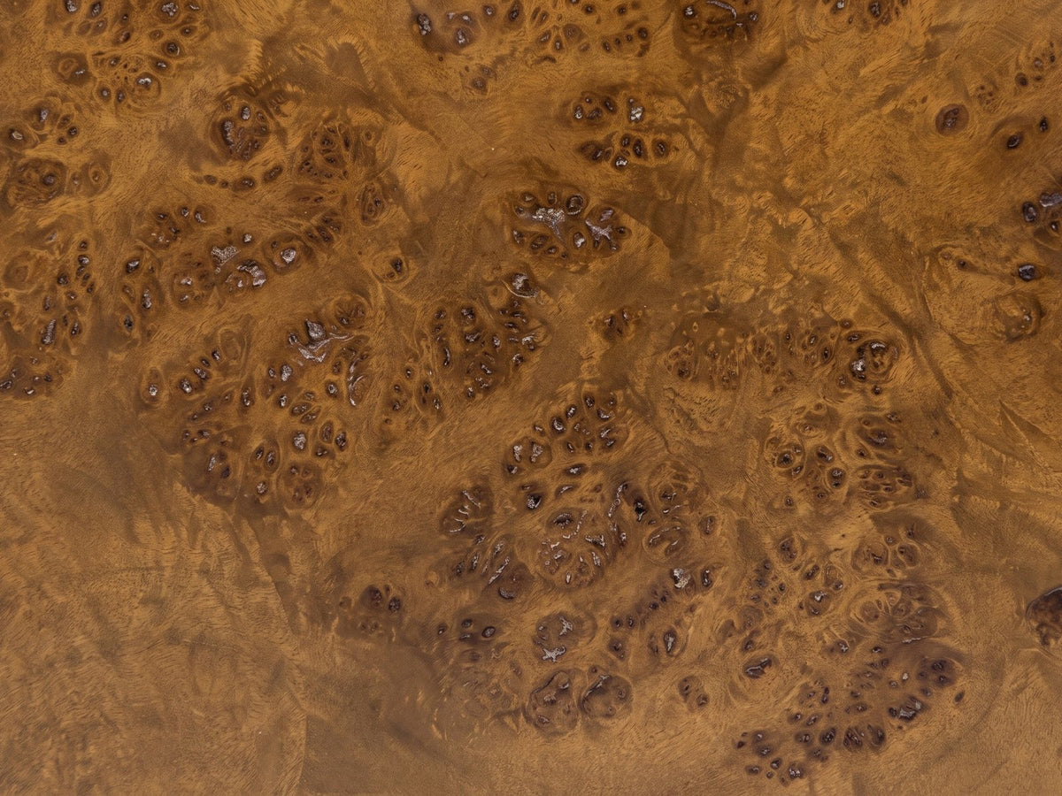 Close-up of the Potenza Walnut Burl Pillar Side Table: the walnut burl veneer of the round top