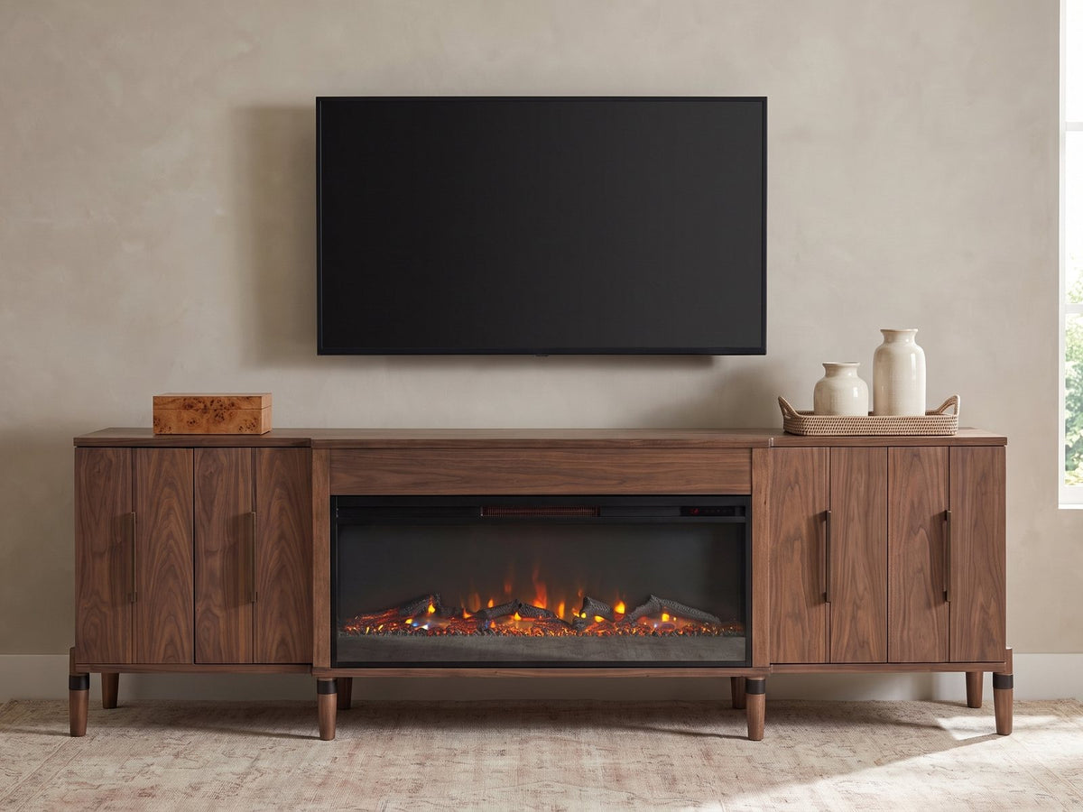 Praiano Walnut Fireplace Media Console styled with a box, a tray of vases and books under a wall-mounted screen