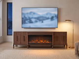 Praiano Walnut Fireplace Media Console under a screen showing a snowy landscape on a winter evening
