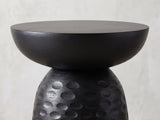 Close-up of the Presicce Black Mango Scalloped Pedestal Side Table: the smooth bowl-shaped top resting on the carved bell base