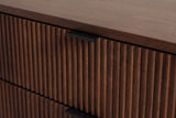The top drawer of the Pula nightstand: narrow vertical walnut reeds and the matte black tab pull folding over its top edge