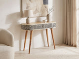 Pulsano Bone Inlay Oval Console Table against a plaster wall under an abstract canvas in a bright living room