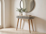 Pulsano Bone Inlay Oval Console Table under a round mirror in a travertine entryway