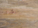 Close-up of the Pulsano Bone Inlay Oval Console Table: the natural grain of the solid mango top