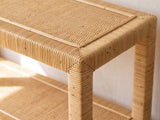 Close-up of the Putignano Wrapped Rattan Two-Tier Console Table: the wrapped rattan corner of the top above a square leg