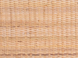 Close-up of the Putignano Wrapped Rattan Two-Tier Console Table: the woven rattan panel of the top