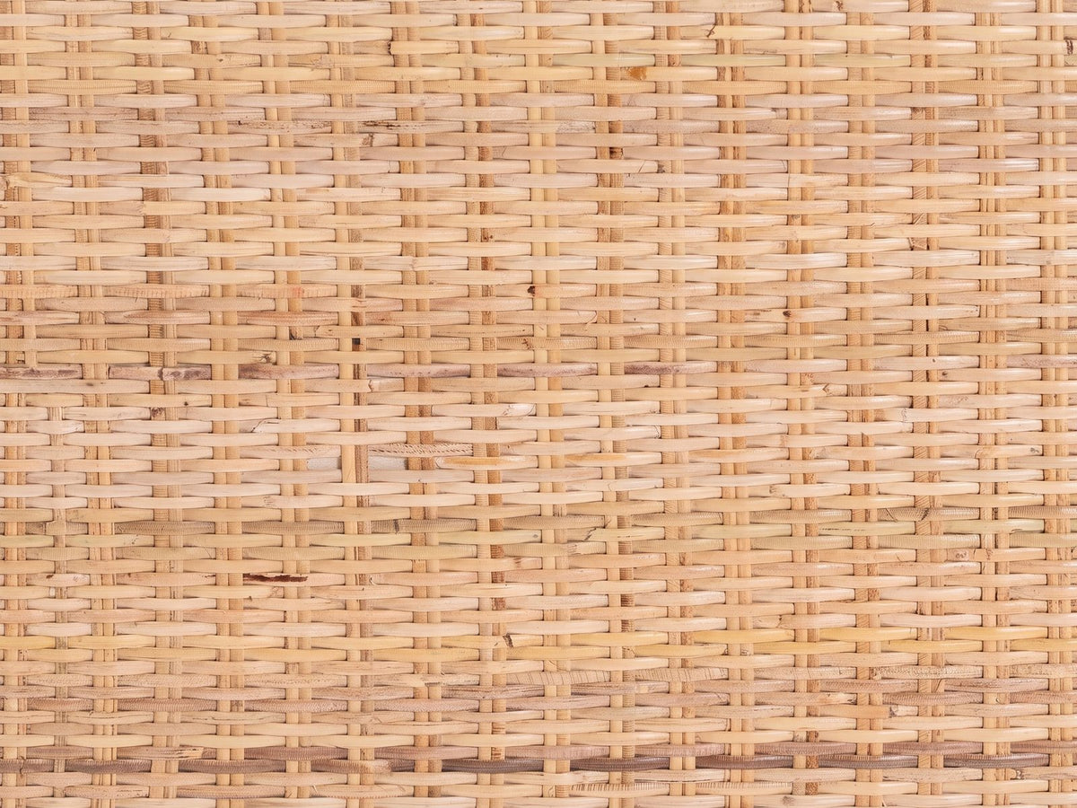 Close-up of the Putignano Wrapped Rattan Two-Tier Console Table: the woven rattan panel of the top